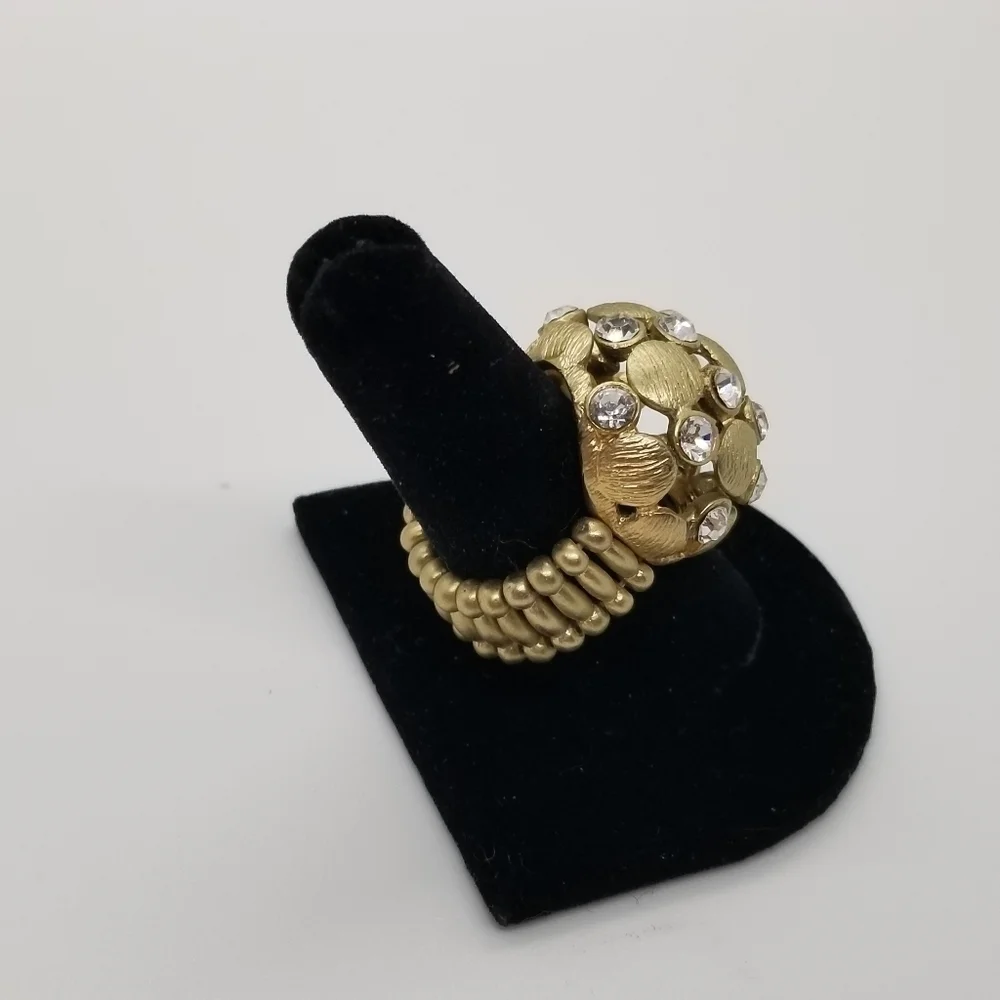 brushed gold tone dome stretch ring with crystal accents